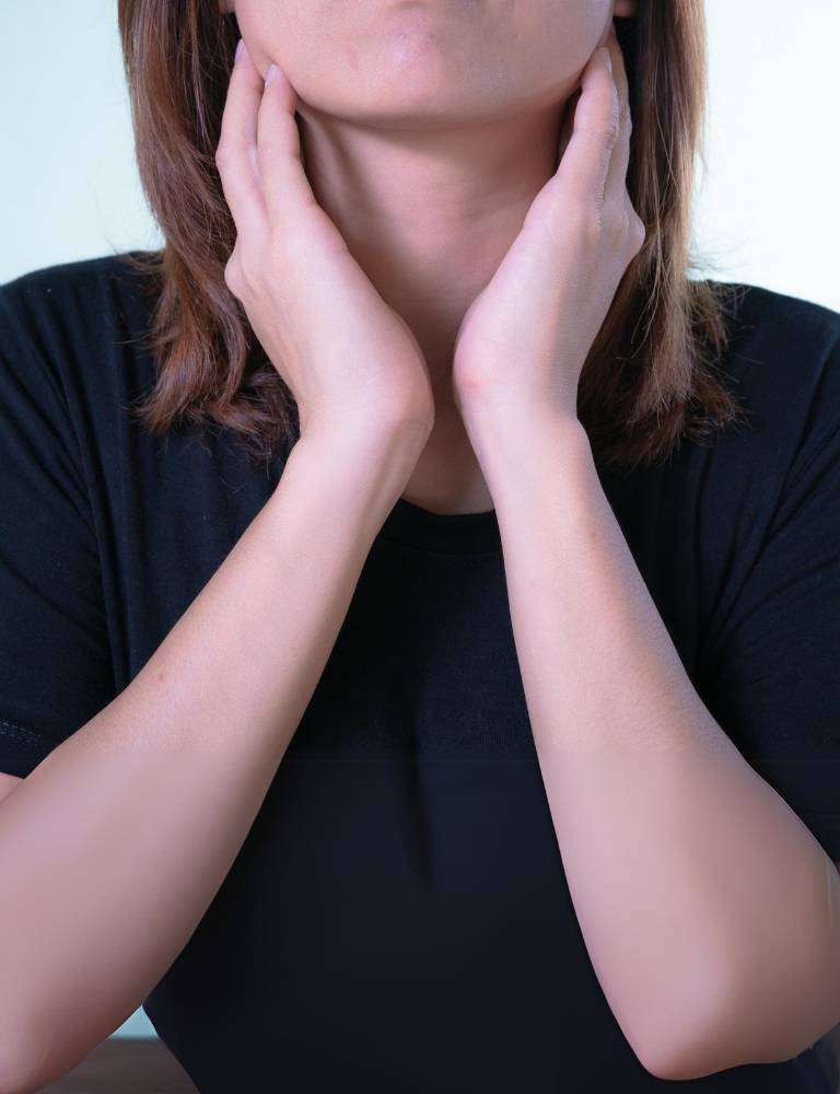 Woman with sore throat — tonsillitis and throat specialist Singapore